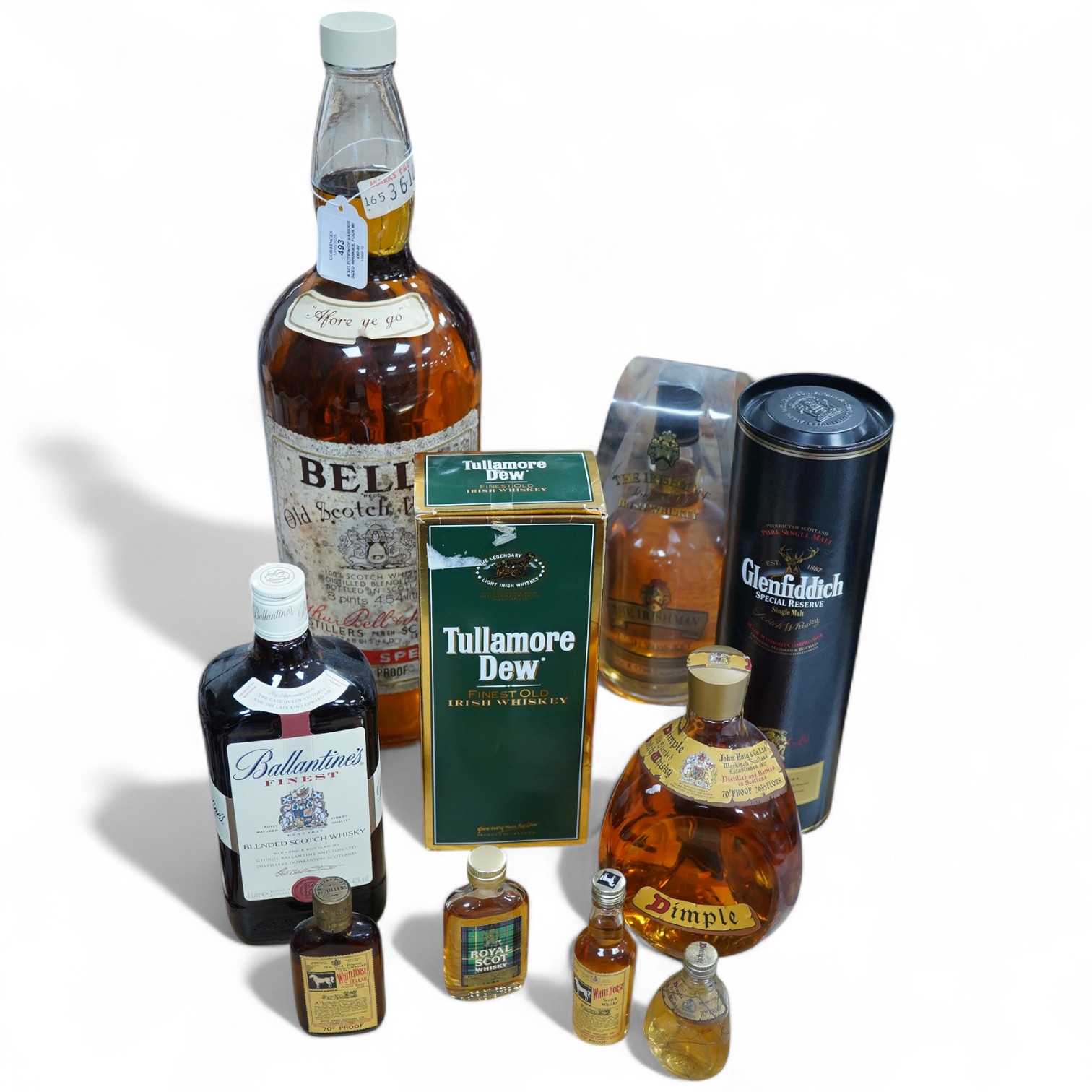 Ten bottles of Whisky including a gallon bottle of Bells. , Condition - good